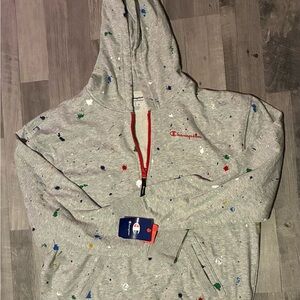 Grey Champion hoodie with paint splotch print.